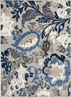 an area rug with blue and gray flowers on the side, in front of a white background