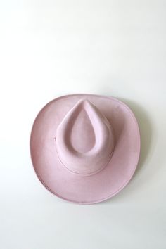 Saddle up in style with the Amarillo vegan suede cowboy rancher hat in a charming pale dusty rose color. Made from high-quality vegan suede, this hat not only looks great but is also environmentally friendly. Perfect for adding a touch of whimsy to any outfit. Yee-haw! Vegan SuedeColor: Pale Dusty Rose - Durable Stiff Brim- 3" lifted Brim- One Size fits most (Elastic inner band to fit S,M, L - 55cm-59cm) - Handmade item- Made in Mexico * Product color and quality as seen on a monitor may vary sl Suede Hat, Rancher Hat, Dusty Rose Color, Yee Haw, Felt Hat, Wool Hat, Custom Hats, Rose Color, Dusty Rose