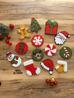 christmas themed felt appliques on a wooden surface