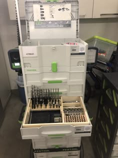 a tool box with many tools in it and some drawers on the side, all stacked together