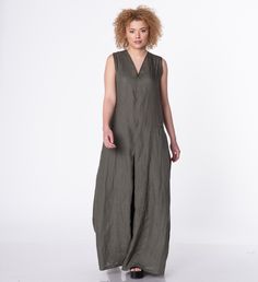 "This modern and comfortable jumpsuit is crafted from cool, breathable linen material for ultimate comfort throughout the day. Featuring sleeveless design, side pockets and hidden zipper on the back for closure. This model is so comfortable and at the same time super elegant and chic. You can style it with high wedges or some flats. Effortless style has never been easier. A review from our customer Fernie: \"This linen JUMPSUIT IS AMAZING! It's SO COMFY AND WELL-MADE! I can WEAR IT WITH SO MANY Summer Linen Jumpsuits And Rompers With Pockets, Casual Sleeveless Linen Jumpsuits And Rompers, Relaxed Fit Linen Jumpsuit With V-neck, Casual Sleeveless Linen Jumpsuit, Jumpsuit Linen, Jumpsuit Plus Size, Palazzo Jumpsuit, Jumpsuit Wide Leg, Plus Size Linen