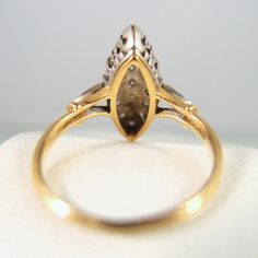 "IMPORTANT: A description is available following the details. Please, read on. Thank you. Material: 18K solid gold, ~21 brilliant cut natural diamonds Size: 6 Weight: 3.1g Period: Mid Century, Retro Style: marquise Origin: France Provenance: an estate sale Condition: excellent vintage, minor wear Addition remarks: stamped with the French owl assay mark to guarantee its 18 carat solid gold content. It has also been professionally tested to be 18-carat solid gold content N.b.: We guarantee the aut Gold Marquise Ring With Diamond Accents, Fine Jewelry Marquise Cut Yellow Gold Diamond Ring, Fine Jewelry Yellow Gold Marquise Cut Diamond Ring, 14k Gold Marquise Cluster Ring, Marquise Cluster Ring In 14k Gold, Yellow Gold Marquise Diamond Ring, Yellow Gold Marquise Cluster Ring With Brilliant Cut, Marquise Cut Yellow Gold Diamond Ring, Yellow Gold Marquise Cut Diamond Ring With Accents