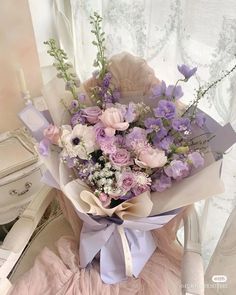 a bouquet of flowers sitting on top of a chair