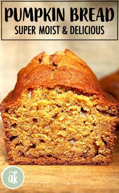 a loaf of pumpkin bread sitting on top of a wooden cutting board with the words, pumpkin bread super moist & delicious