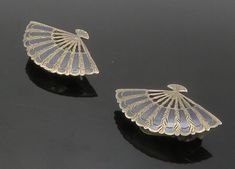 "SIAM 925 Sterling Silver - Vintage Enamel Fan Motif Non-Pierce Earrings - EG7414  SIAM 925 Sterling Silver - Vintage Enamel Fan Motif Non-Pierce Earrings - EG7414  Jewelry Type:         Earrings   Metal Type:            925 Silver  Metal Size:             1.25\"  Stone Type:            N/A  Condition:              N/A  Jewelry Weight:     6.8 Grams  PLEASE NOTE: THIS ITEM IS PRE-OWNED. ALTHOUGH MOST ITEMS ARE IN VERY GOOD CONDITION, SOME MAY NEED CLEANING AND/OR MINOR REPAIRS. WE MAKE A VERY STRONG EFFORT TO UPLOAD CLEAR PICTURES. PLEASE INSPECT ALL PICTURES AND ASK ALL QUESTIONS YOU MAY HAVE PRIOR TO MAKING A PURCHASE. NOT ALL STONES ARE GENUINE, SOME ARE ENHANCED OR CREATED." Elegant Silver Earrings With Inlay, Elegant Silver Inlay Earrings, Earrings Metal, Earings Piercings, Types Of Metal, Metallic Silver, 925 Silver, Jewelry Earrings, 925 Sterling Silver