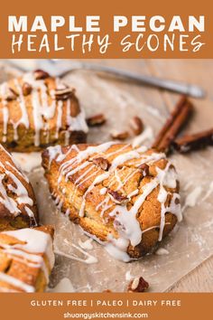 a close up of a plate of food with cinnamon rolls and icing on it