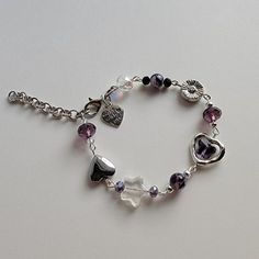 Purple Crystal Beaded Bracelets As Gift, Purple Glass Bracelet, Silver Glass Crystal Bracelet Gift, Adjustable Purple Metal Crystal Bracelet, Purple Beaded Metal Bracelets, Adjustable Purple Metal Charm Bracelet, Purple Glass Bracelets As Gift, Purple Glass Bracelets For Gifts, Purple Glass Beaded Bracelets As Gift