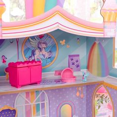 there is a toy house with princess decorations on it