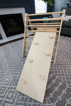 a wooden sled sitting on top of a blue rug