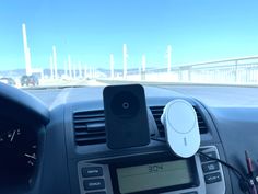 an electronic device is attached to the dashboard of a car