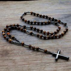 Item Type: Men's Necklaces Material: Metal, Stone Length: 65 cm / 25.59 inch Cross Size: 3.5 cm / 1.38 inch Package Includes: 1 x Necklace Rosary Cross, Crystal Cross, Stone Beaded Necklace, Rosary Necklace, Lapis Lazuli Stone, Onyx Bracelet, Tiger Eye Beads, Rosary Beads, Tiger Eye Stone