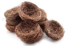 several balls of brown yarn on a white background