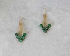 This one of a kind pair of earrings is made from hand crafted gold German Style wire, green and black glass beads, and nickel free ear wires. Earrings, from ear wire to bottom bead are 2  3/4" in length. I invite you to come on in and browse my shop's entire selection of handcrafted jewelry! https://www.etsy.com/shop/BeauFaireCreations Stitch Beads, Hand Beaded Earrings, German Style, Jewelry Making Earrings, Diy Earring, Earrings Diy, Earring Ideas, Making Earrings, Bead Jewellery