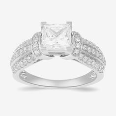 Ring Style: Side Stone Rings, Engagement Rings, Single Center RingsDiamond Clarity: I1Setting: ProngShape: PrincessStone Cut: PrincessStone Millimeter Measurement: 6.2 Mm LengthDiamond Color: GMetal Color: WhiteCenter Stone Weight: 1 1/2 Ct.Ring Gallery Height: 9.8mmRing Top Length: 22.3mmRing Top Width: 7.9mmRounded Carat Weight: 2 Ct. T.w.Band Width: Care: Wipe CleanStone Type: 51 Lab Grown DiamondAuthenticity: Lab Grown DiamondMetal: 10k White GoldCountry of Origin: Imported Timeless White Jewelry With Vs Clarity, Classic Promise Ring With Channel Set, Classic Promise Rings With Channel Set, Classic Channel Set Ring For Promise, Platinum Channel Set Ring For Promise, White Halo Ring With Princess Cut For Anniversary, Princess Cut Cubic Zirconia Ring Channel Set, Timeless White Rings With Vs Clarity, 14k White Gold Channel Set Ring