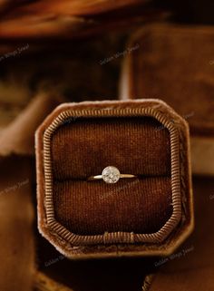 an engagement ring in a velvet box