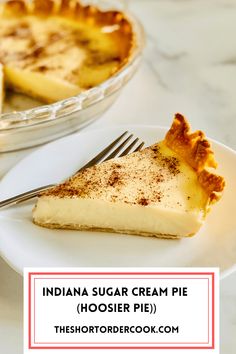 a piece of pie on a plate with a fork next to it and the words indiana sugar cream pie hosier pie