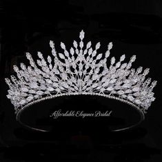 a tiara is shown in the dark, with its crystal stones and leaves on it