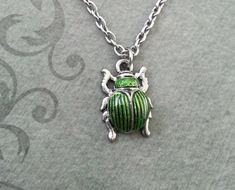 Scarab Necklace VERY SMALL Scarab Jewelry Egyptian Necklace Egyptian Jewelry Beetle Necklace Silver Green Metal Necklaces With Charms, Green Metal Necklace With Charms, Green Nickel-free Pendant Charm Necklace, Adjustable Green Charm Necklace, Green Metal Pendant Charm Necklaces, Adjustable Green Metal Necklaces, Green Charm Necklace With Adjustable Chain, Eat Jewelry, Insect Jewelry Design