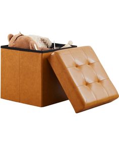 an ottoman with a stuffed animal in it