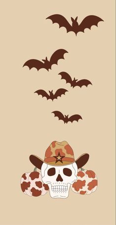 a skull wearing a cowboy hat with bats flying above it in the sky behind him