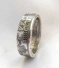 I present to you a beautiful ring from the Florin of the Austro-Hungarian Empire. This ring is made from a very old coin. Coins of this type were made in Austria-Hungary from 1857 to 1892. Metal: Silver 0.900 I can make sizes from 7 to 11 1\2 US. If you need a certain year on the ring (1857-1892) - write to me, and I'll see if it can be done. I need 3 to 5 business days to make ring. Vintage Coin-shape Engraved Ring For Anniversary, Vintage Coin-shaped Engraved Anniversary Ring, Vintage Coin Engraved Anniversary Ring, Heirloom Coin Shaped Hallmarked Rings, Heirloom Silver Rings For Commemoration, Vintage Engraved Ring For Commemoration, Vintage Engraved Commemoration Ring, Vintage Engraved Commemorative Ring, Antique Engraved Ring For Commemoration