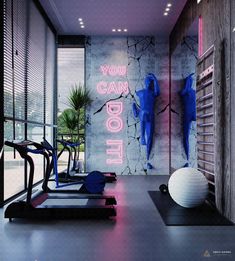 there is a gym with exercise equipment and neon signs on the wall behind it that says you can do it