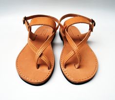 These sandals are custom made to order. Please contact me in case you have narrow or wide feet. You can customize each pair in the available colors or you can contact me for more details. Women sandals pictured in natural tan. They are made from Greek thick cow leather making them very strong. SIZES Please visit the last image of this listing in order to follow the instructions on how to measure your feet. Available women's sizes EU Size 35 - USA Size 4 (9.25 inches/23.5 cm sole length) EU Size Clothing Capsule, Satin Ballet Flats, Tan Leather Sandals, Nice Sandals, Leather Sandals Handmade, Handmade Sandals, Tan Sandals, Shoe Pattern, Leather Sandals Women