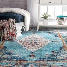 a blue area rug in a living room