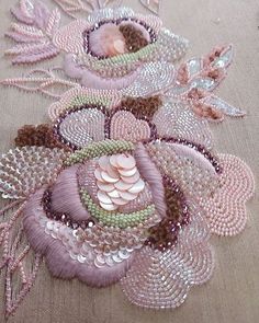 a close up of a table cloth with beads and sequins on it's edges