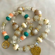 Bohemian Bracelets With The Color White,Pink,Blue,Silver And Gold With A Three And Heart Pendent Very Beautiful Heishi Jewelry, The Color White, Fendi Bracelet, Heart Pendent, Chanel Bracelet, Twisted Bangle, Faux Pearl Bracelet, Bohemian Bracelets, Beaded Wraps