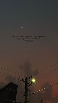 an airplane flying in the sky above power lines and telephone poles at dusk with a quote written on it