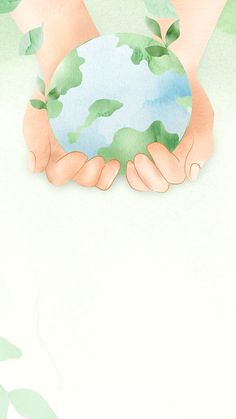 two hands holding a globe with leaves on it