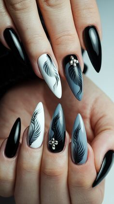 Elevate your nail game with this exquisite monochrome design! Featuring elegant feathers painted in black on a white and gray background, these nails embody sophistication and style. The glossy finish paired with subtle metallic details adds an extra layer of elegance, making them perfect for any occasion. Embrace your inner artist and try this look today!
#winternails #acrylicnails #nailsdesign #nailsinspo #decembernails