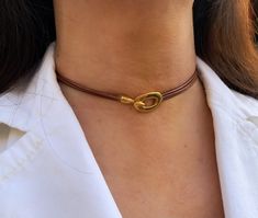 This beautiful and dainty necklace is a great gift idea for a friend, a loved one or just for yourself. It is handmade to order by me using 2mm real leather cord and gold colour zamak hook clasp  2cm X 1.5cm.  📌 HOW TO CHOOSE YOUR CHOKER SIZE: The best way to take your measuring is by using a flexible measuring tape on your neck.  Please make sure that the tape is not loose around your neck , it should be just tight enough.  Whatever measurement you get, add 0.5 inches for comfort and that shou Handmade Choker For Everyday Use, Minimalist Choker With Lobster Clasp As Gift, Elegant Adjustable Cord Choker As Gift, Elegant Adjustable Cord Choker, Elegant Brown Jewelry For Everyday Use, Elegant Adjustable Cord Necklace For Gift, Elegant Handmade Jewelry For Everyday Use, Adjustable Lobster Clasp Choker For Gift, Brown Choker Necklace For Gift