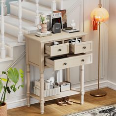 a small table with drawers underneath a stair case