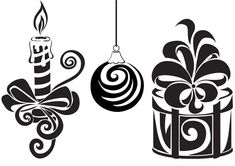 three christmas ornaments hanging from strings with ribbons and bows, one in the shape of a candle