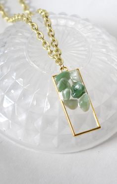 green crystal necklace with stones, ethereal stone necklace, aventurine chip jewelry, aventurine necklace, celestial aesthetic jewelry ideas, aesthetic summer outfit ideas women, western aesthetic, gift ideas sister, summer 2023 jewelry, summer 2023 ideas outfit, nashville summer accessories, summer style jewelry, gold green celestial jewelry, gold ethereal aesthetic necklace, witchy aesthetic jewelry astrology, east nashville outfits, cottagecore inspiration earth signs astrology, fairycore Gold Jade Gemstone Crystal Necklace, Gold Jade Crystal Necklace With Gemstone, Gold Aventurine Gemstone Necklace, Gold Aventurine Necklace With Gemstone, Gold Aventurine Necklaces For Healing, Gold Jade Crystal Necklaces As Gifts, Gold Jade Crystal Necklace Gift, Gold Jade Crystal Necklace As Gift, Spiritual Green Necklace With Rectangular Pendant