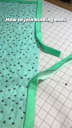 how to join binding ends on a quilted piece of cloth with green ribbon and black stars