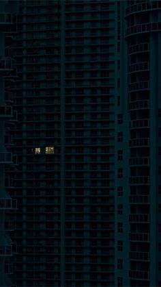 an airplane is flying in the sky over some tall buildings at night with one window lit up