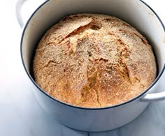 a loaf of bread in a white pot