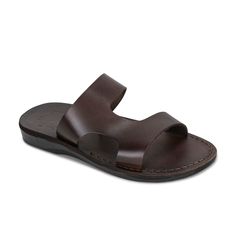 Meet 'June'—the epitome of effortless chic for the contemporary woman. This sandal is a fusion of simple elegance and practical design, ideal for those who appreciate subtlety with a touch of class. 'June' is crafted from soft, brown leather, ensuring both comfort and longevity. Its broad, asymmetrical straps offer a modern aesthetic while providing a secure fit that’s perfect for day-long wear. Whether paired with a breezy summer dress or your go-to jeans, the 'June' sandal is versatile enough to complement any outfit. With its sleek profile and comfortable sole, it’s the perfect staple for any fashion-forward wardrobe. Vegetable-tanned natural leather Leather sole molds to your feet Comfortable polyurethane outsole Durable textured grip sole Light and flexible Hand-Crafted in East Jerusa Classic Toe Loop Sandals For Summer, Classic Summer Toe Loop Sandals, Classic Toe Loop Flip Flops For Summer, Classic Sandals With Rubber Sole For Summer, Classic Summer Sandals With Rubber Sole, Classic Summer Sandals With Leather Sole, June Brown, Jesus Sandals, Vegan Leather Bag