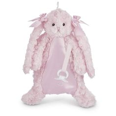 a pink stuffed animal with a white ribbon around its neck and ears, sitting on a white background