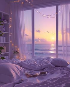 the sun is setting over the ocean from a bed