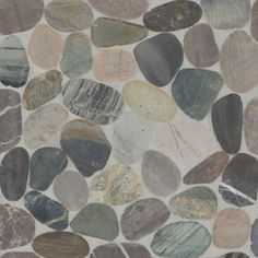 a stone wall with various colored rocks on it