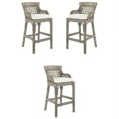 four grey wicker barstools with white cushions on each side and one in the middle