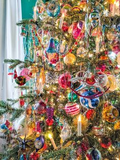 a christmas tree decorated with ornaments and lights