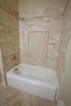 a bath tub sitting in the corner of a bathroom