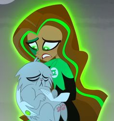 a woman holding a cat in her arms with green eyes and an evil look on her face