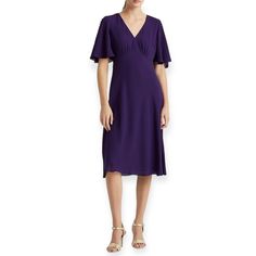 Make A Statement With This Stunning Lauren Ralph Lauren Dress, Featuring A Beautiful Purple Color In Size 2. The Dress Is Crafted With A Chiffon Fabric Type, Making It An Elegant And Comfortable Choice For Any Occasion. Its V-Neckline And Flutter Sleeves Add A Feminine Touch, While The Button Detail Closure Provides A Sleek And Sophisticated Look. This Midi-Length Dress Comes In A Fit & Flare, Shift, And A-Line Style, Ensuring A Flattering Fit For All Body Types. Whether You're Dressing Up For A Elegant Flutter Sleeve Dress In Solid Color, Elegant Dress With Flutter Sleeves In Solid Color, Elegant Solid Color Dress With Flutter Sleeves, Flutter Sleeve Midi Dress For Formal Occasions, Ralph Lauren Summer Midi Dress For Daywear, Fitted Midi Dress With Ruffle Sleeves For Daywear, Ralph Lauren Midi Dress For Summer Daywear, Formal Fitted Midi Dress With Flutter Sleeves, Ruffle Sleeve Midi Dress For Formal Occasions