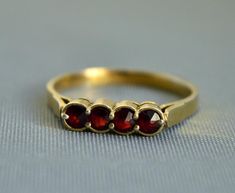 Vintage Bohemian garnet band ring, gilded 900 silver setting. Size: US 8, UK P 1/2 Ring's face measures: 5 mm x 9 mm  Weight 1.8 grams Hallmarked: 900 for European silver, rabbit for Bohemian garnet, maker's mark Nice vintage condition Will be delivered by tracked signed mail Thank you for looking. Please see my other items. Garnet Ring Vintage, Garnet Ring, Silver Band Ring, Maker's Mark, Garnet Rings, Vintage Bohemian, Vintage Boho, Silver Band, Makers Mark